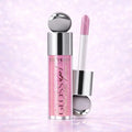 Gloss up! lip gloss with applicator on a light purple background