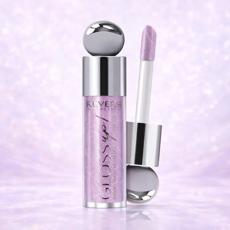 Gloss up! Lip gloss with applicator on a purple background