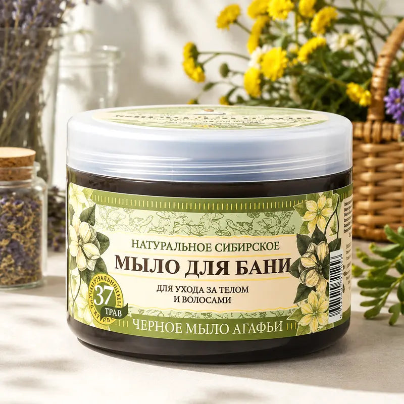 Jar of natural Siberian Grandma Agafia Black Soap with decorative elements on a light background