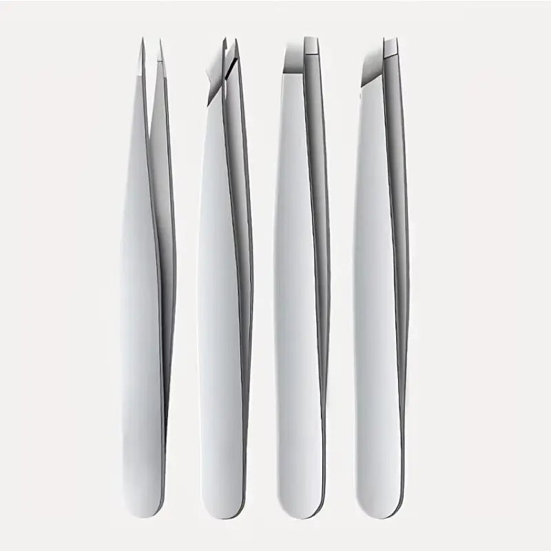 Set of silver tweezers on a white background