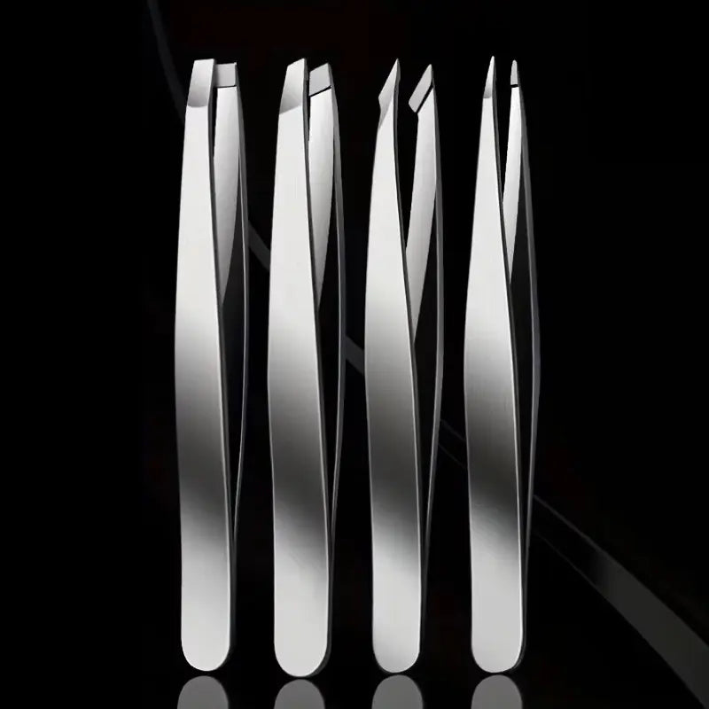 Set of silver tweezers on a black background